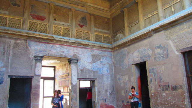 Inside a 2 storey house with original decorations on the upper floor