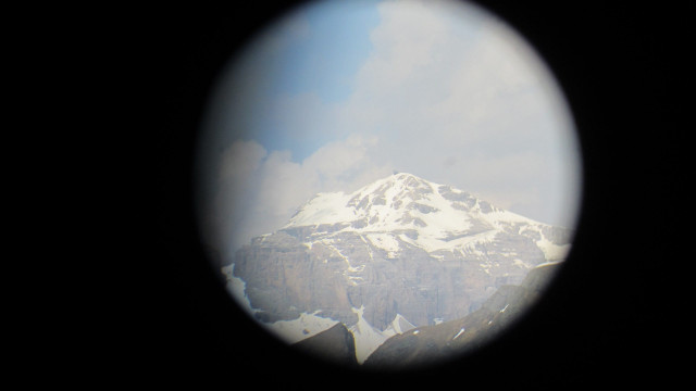 Taken through a binocular of a distant Refugio (the small hut on the top of the mountain)